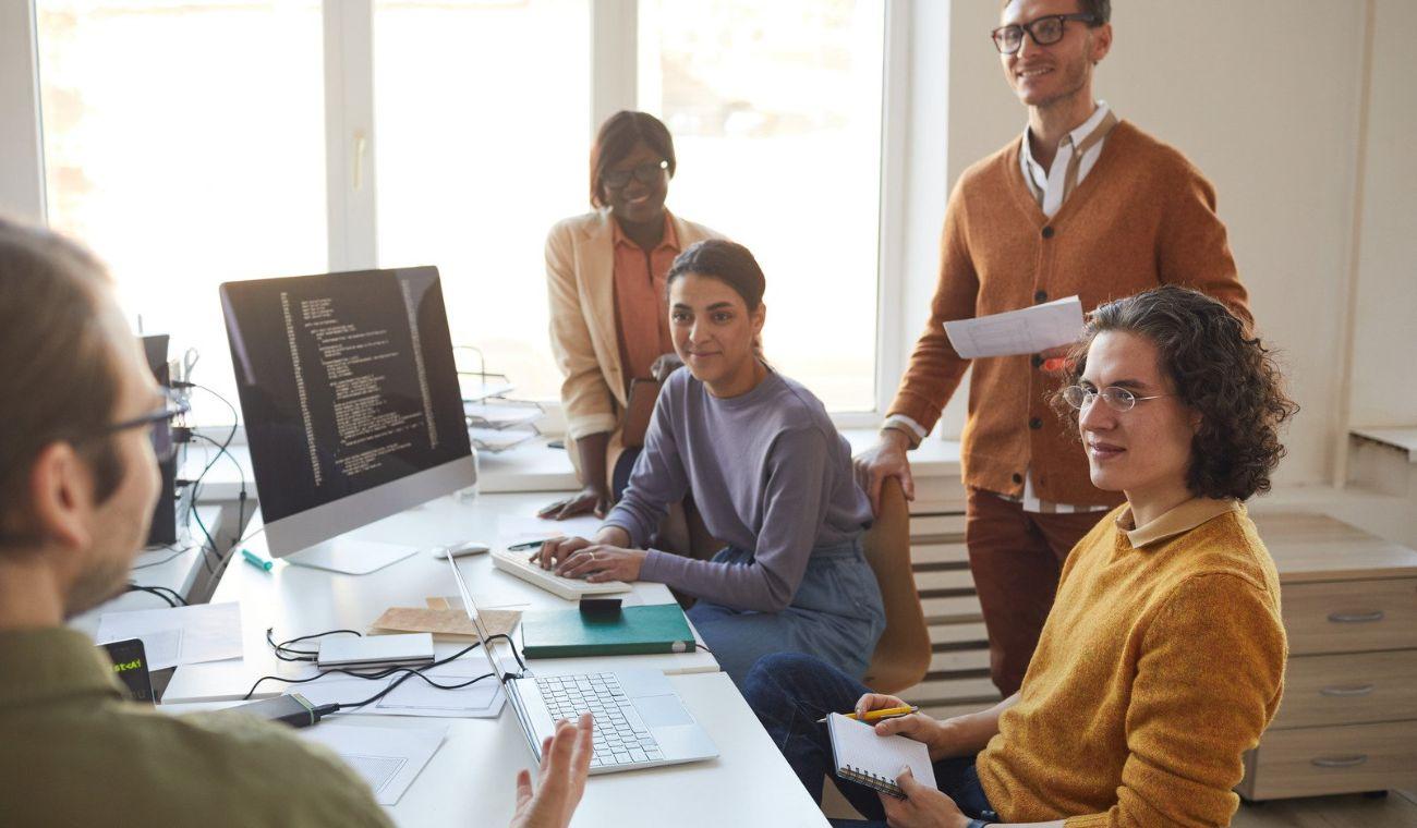 people looking at a computer