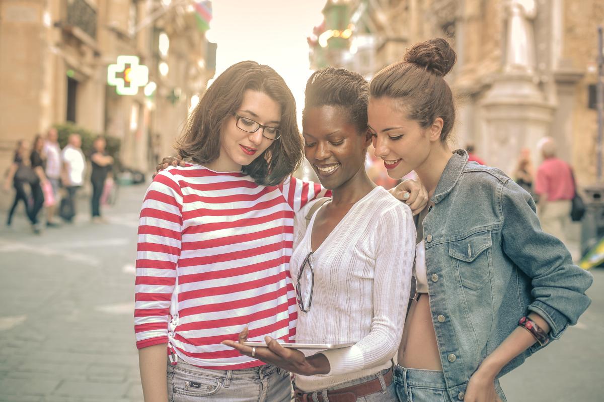 Three girls looking at the Tablet