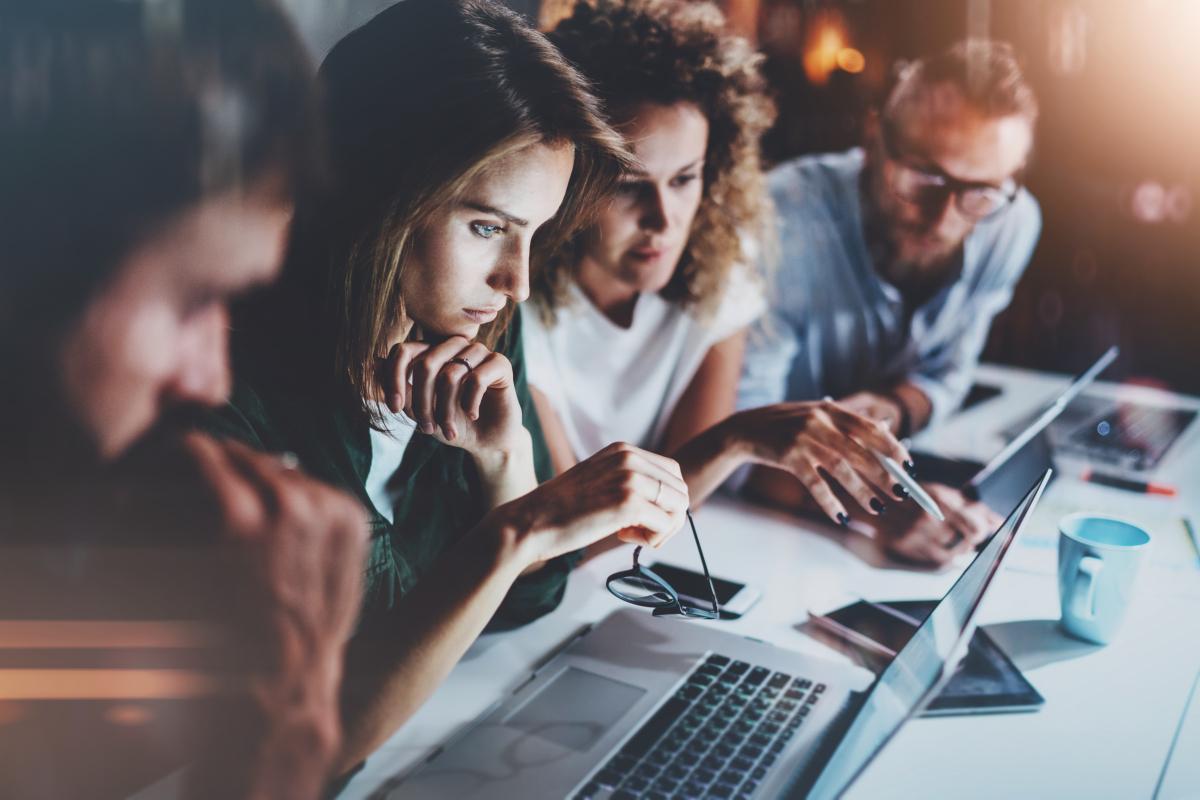 people looking at a screen